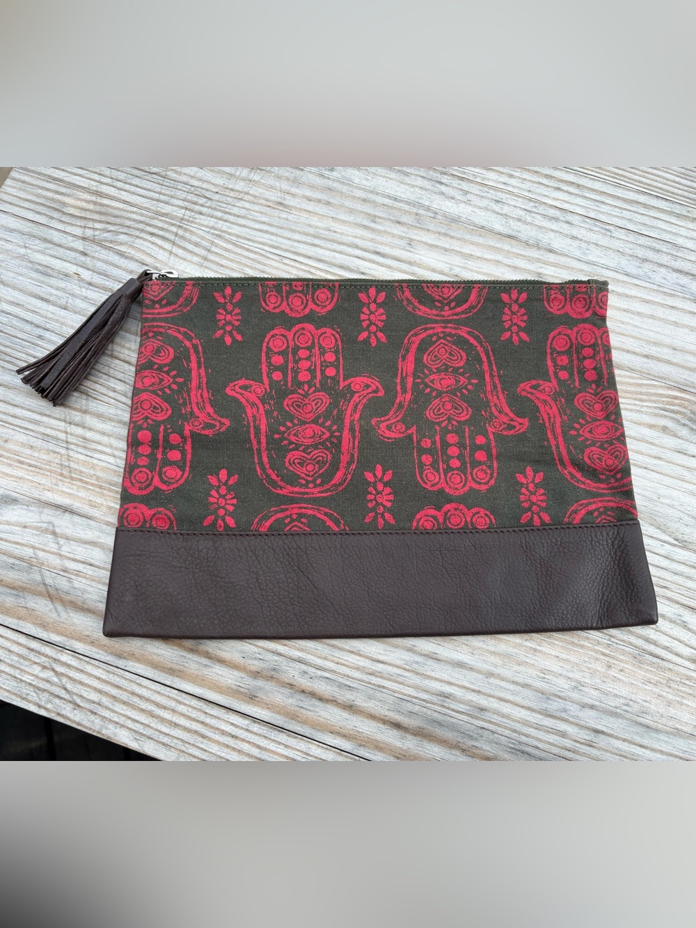 The Onikas for Bloom & Give Hamsa Hand Clutch with Tassel Pull